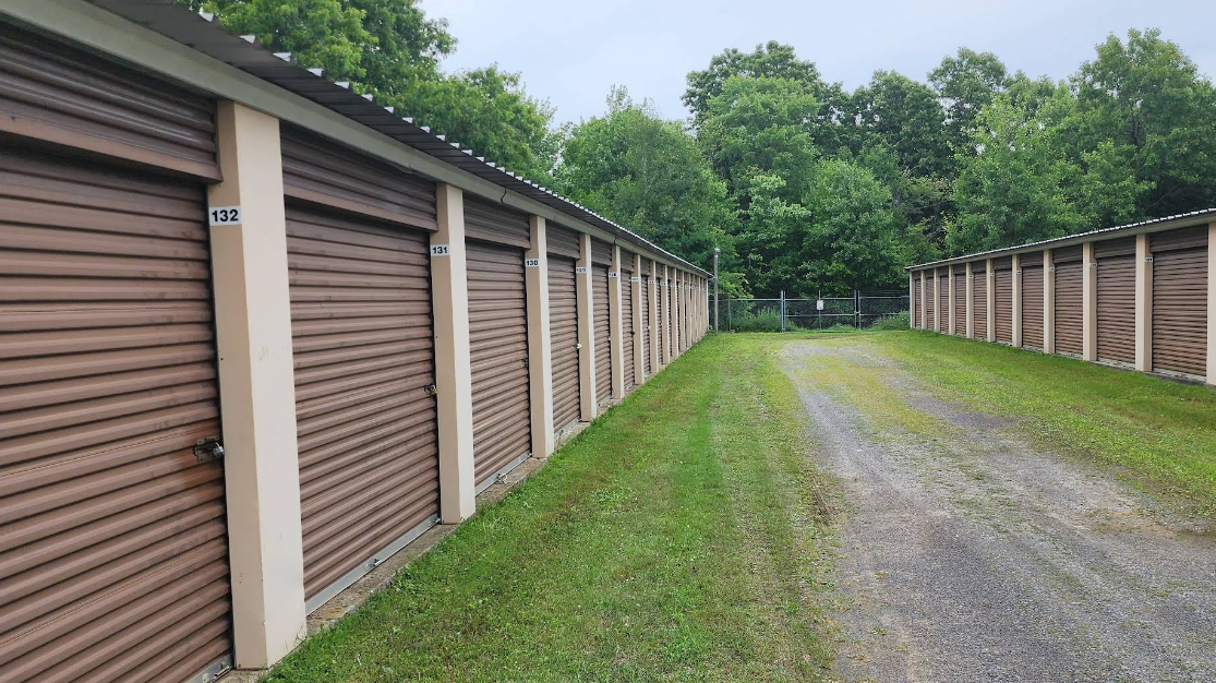 Well-lit drive aisle for evening loading at the gated Cherry Tree Self Storage facility in Franklin, Pennsylvania