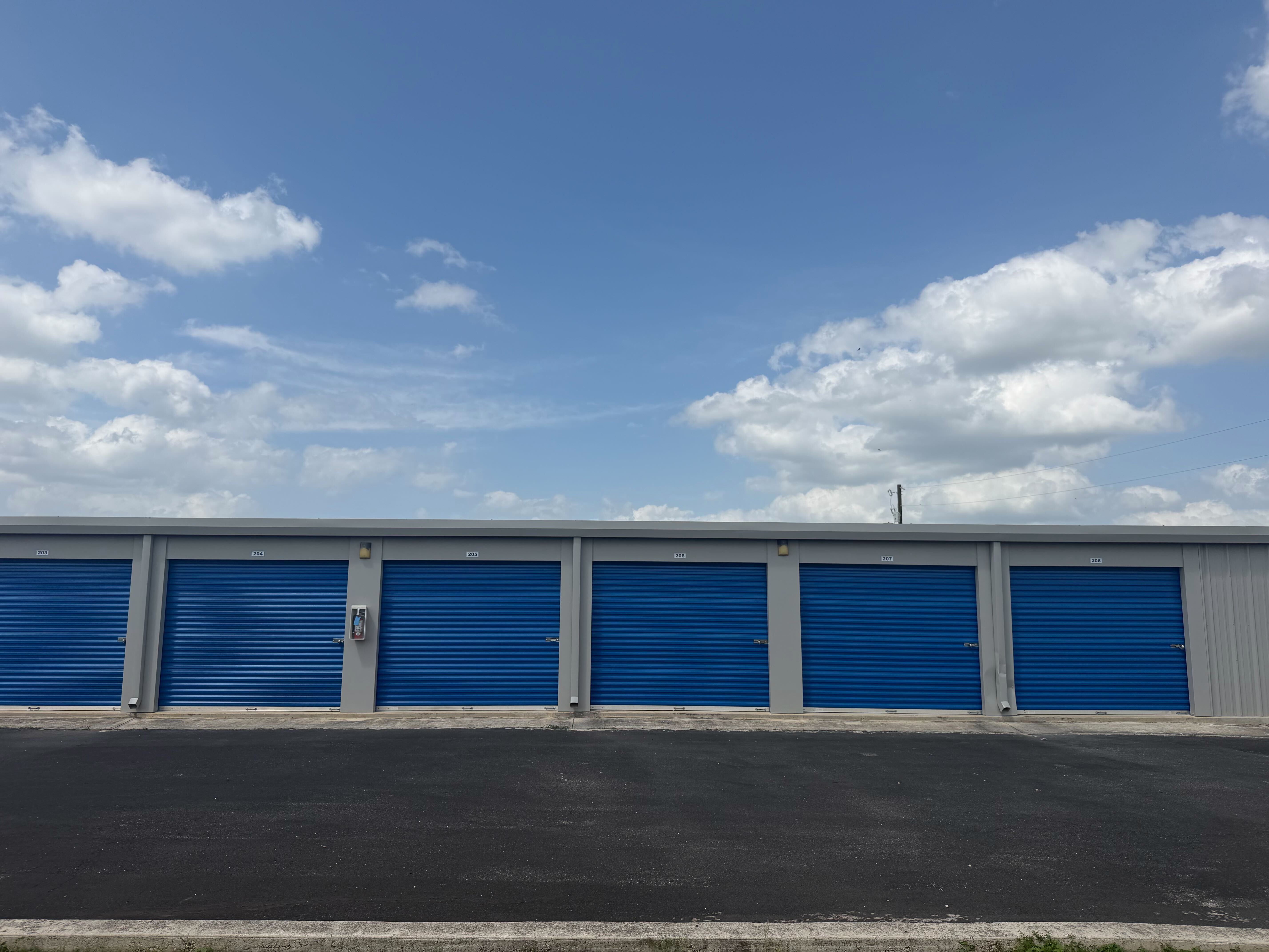 Outdoor vehicle, boat and RV parking beside storage buildings at Matador Self Storage Seguin