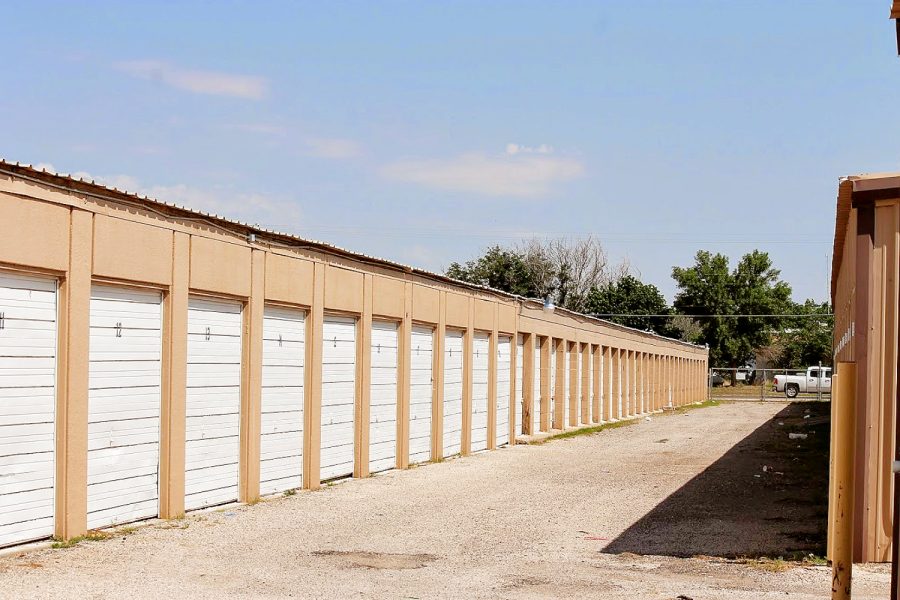 Household loading at an outdoor drive-up storage unit door at Presto Storage in Odessa