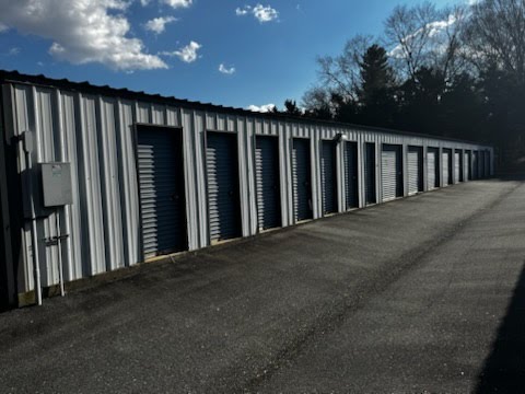 Row of storage unit doors showing size options from 5x5 to 10x25 at Winston Self Storage