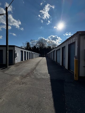 Side-by-side view of storage buildings at Winston Self Storage for climate-controlled and drive-up unit types