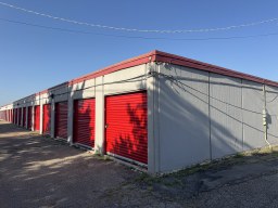 Row of drive-up storage unit sizes including 5x10, 10x10, and 10x20 at Yukon Self Storage