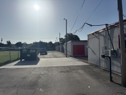 Drive-up storage units behind a keypad gate at Yukon Self Storage in Yukon, Oklahoma